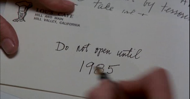 Marty writes the letter, a sign of the future, for Doc to discover to escape his fate.